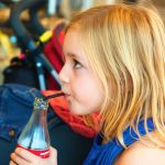 Young girl with soft drink | Child dental health