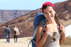 Healthy young woman smiling on hike