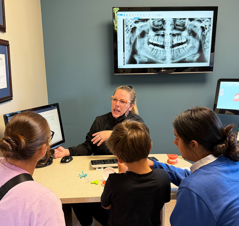 Patient speaking with Halgren team | Halgren Orthodontics in Mt Vernon and Orcas Island, WA