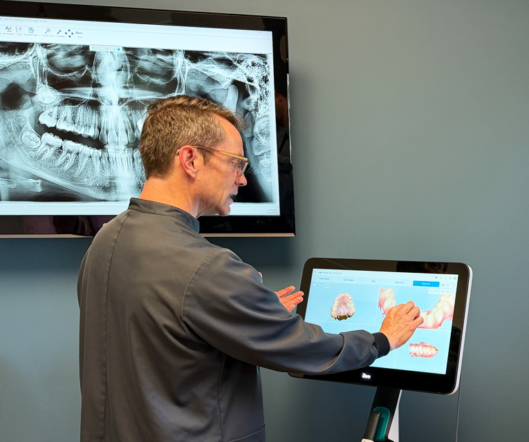 Dr. Halgren evaluates digital imaging - Halgren Orthodontics